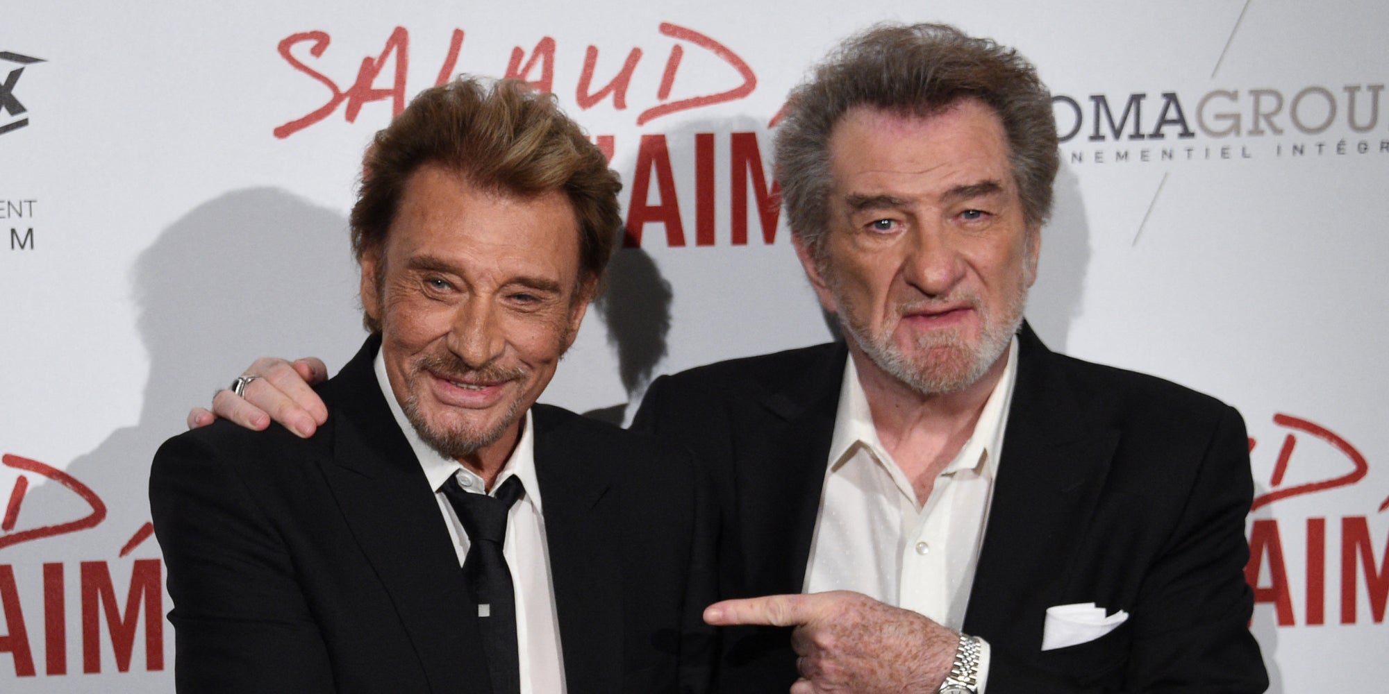 Eddy Mitchell et Johnny Hallyday lors de la première de "Salaud, on t'aime" à Paris, le 4 avril 2014