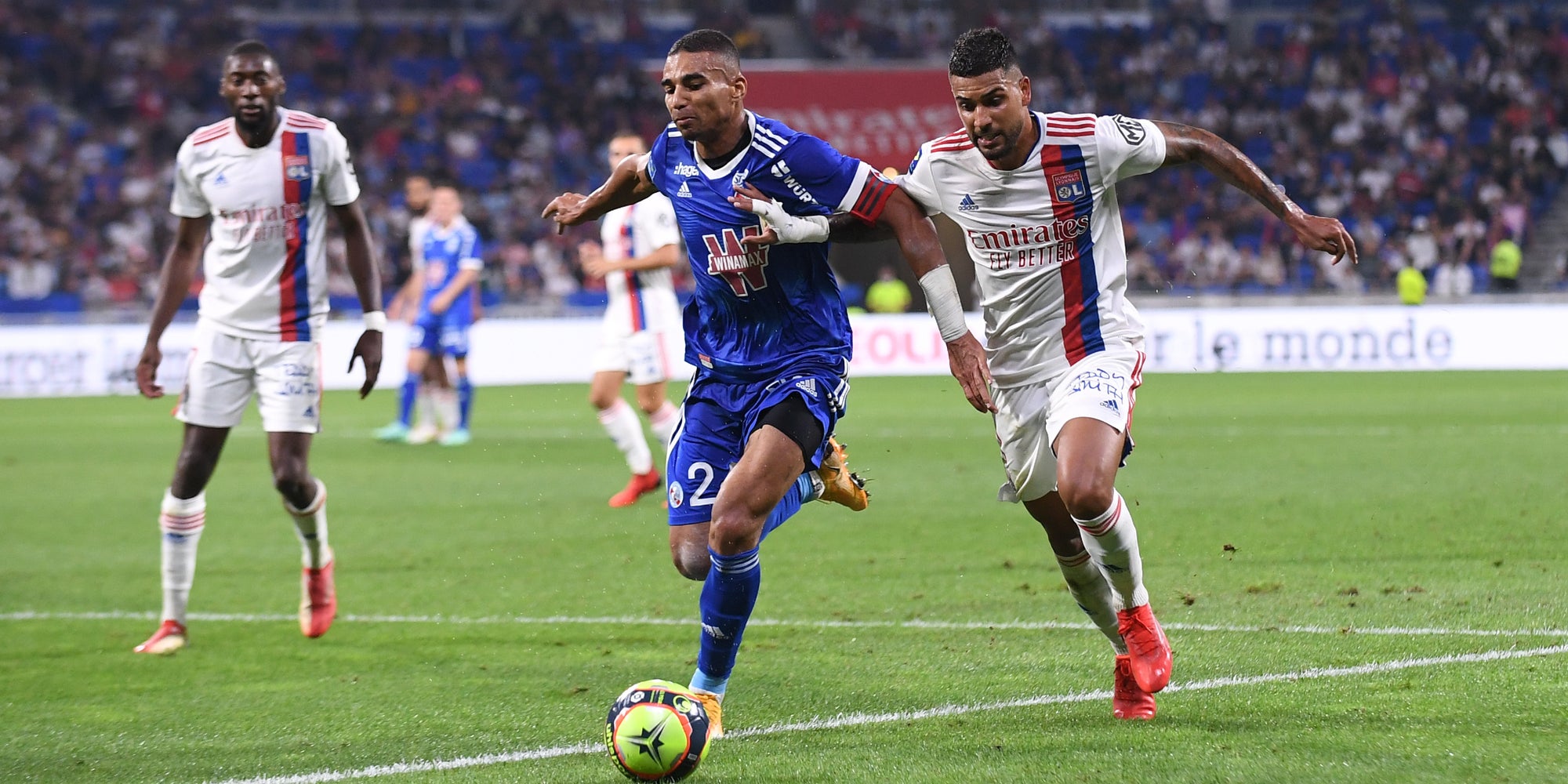 Les joueurs de Lyon et Strasbourg lors du match aller en Ligue 1, le 11 septembre 2021 au Groupama Stadium, Décines-Charpieu